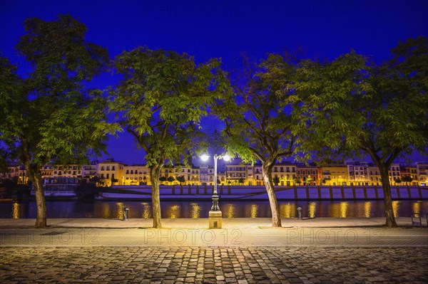 Spain, Andalusia, Seville, Guadalquivir River at night