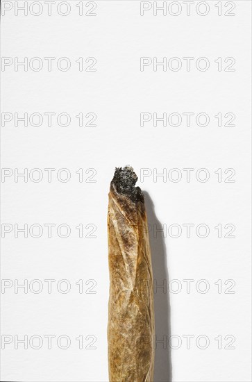 Cannabis cigarette on white background