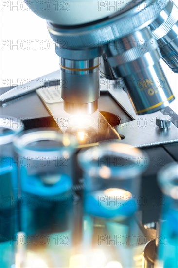 Close-up of test tubes and microscope