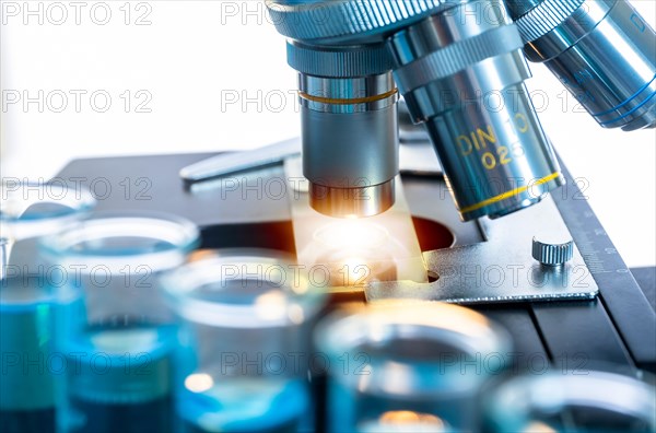 Close-up of test tubes and microscope