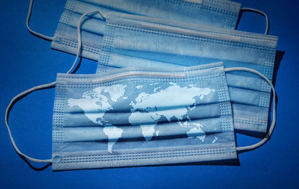 Studio shot of surgical masks with world map