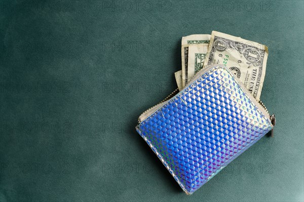 Overhead view of one dollar banknotes in purse