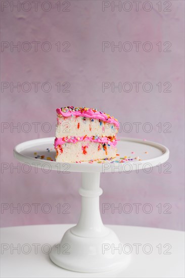 Slice of festive cake on cake stand