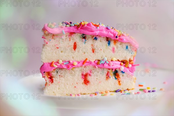 Slice of festive cake on cake stand