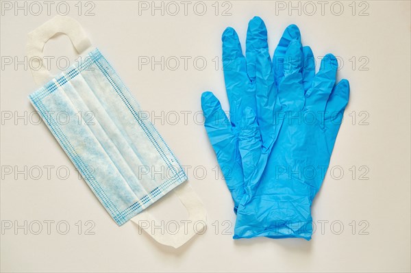 Studio shot of surgical mask and latex gloves