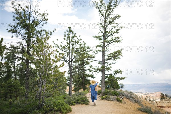 USA, Utah, Bryce Canyon, Woman walking along canyon