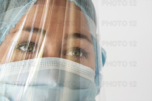 Nurse in mask and face shield