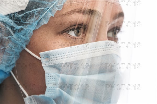 Nurse in mask and face shield