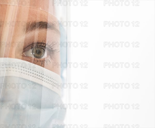 Nurse in mask and face shield