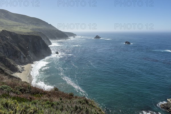 USA, California, Big Sur, Seascape with cliffs and beach on sunny day