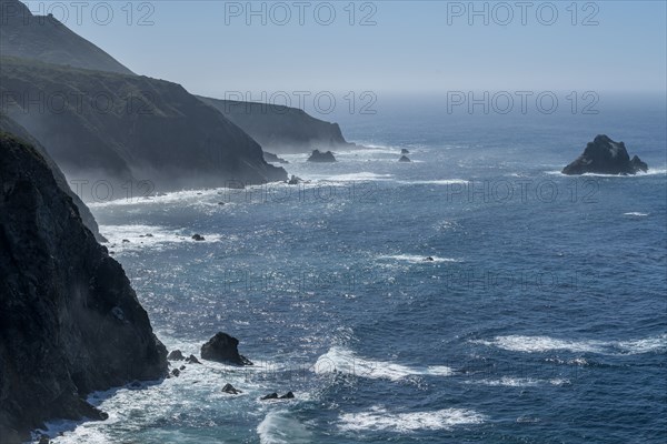 USA, California, Big Sur, Seascape with cliffs and rock formations on sunny day