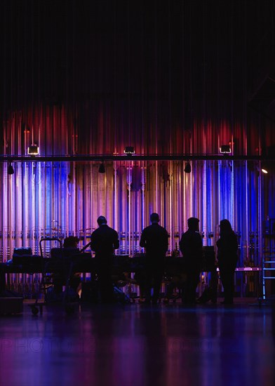 Silhouettes of musicians backstage