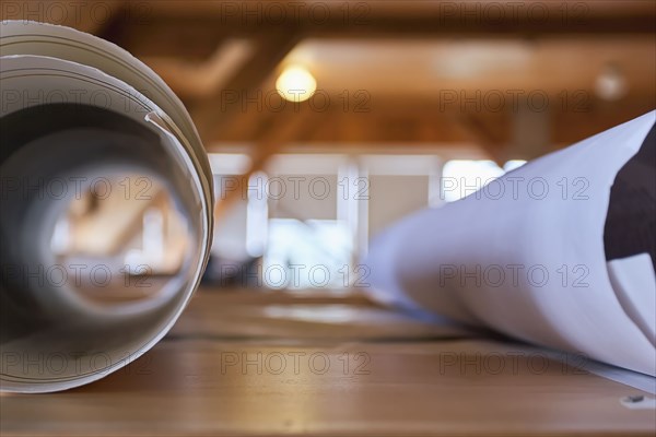 Rolled paper documents on table
