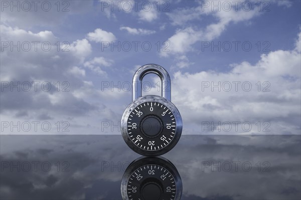 Padlock against clouds