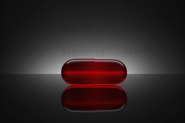 Studio shot of red pill