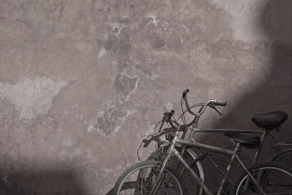 Morocco, Marrakesh, Two bicycles next to old wall