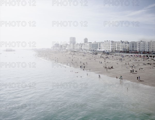 United Kingdom, England, Brighton, People resting at urban beach