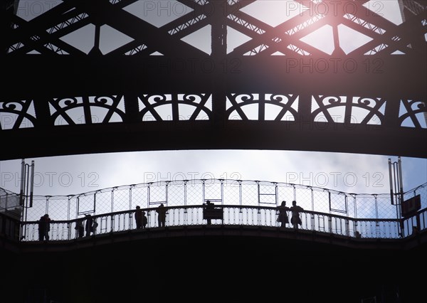 France, Paris, Silhouette of tourists visiting Eiffel Tower