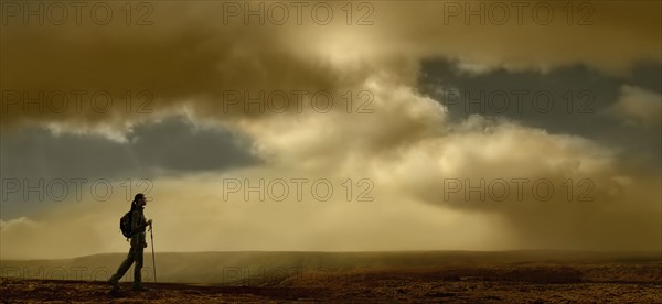 United Kingdom, Scotland, Lone hiker walking in mountains