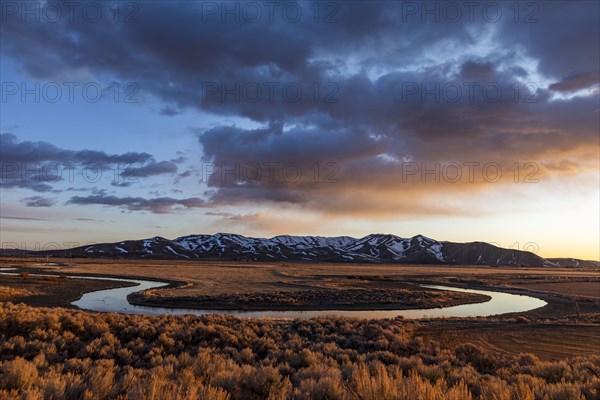 USA, Idaho, Picabo, Sunset over plain and mountain range