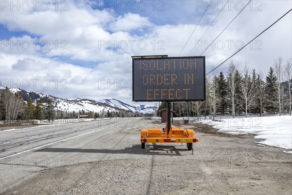 USA, Idaho, Sun Valley, COVID_19 lockdown on travel electronic sign on roadside