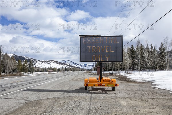 USA, Idaho, Sun Valley, COVID_19 lockdown on travel electronic sign on roadside