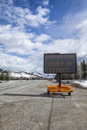 USA, Idaho, Sun Valley, COVID_19 lockdown on travel electronic sign on roadside