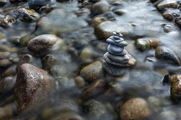 USA, Idaho, Sun Valley, Rock stack among river rocks