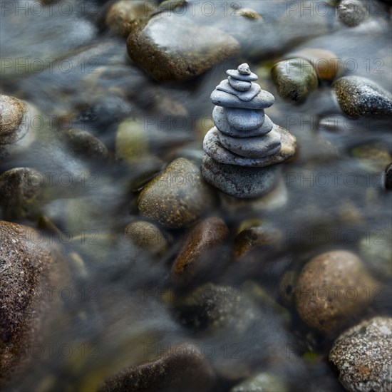 USA, Idaho, Sun Valley, Rock stack among river rocks