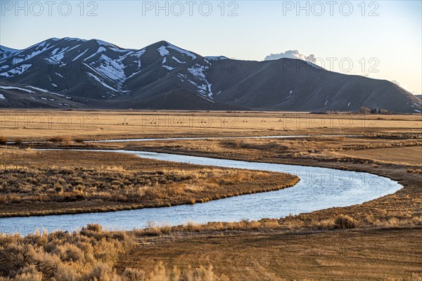 USA, Idaho, Picabo, Landscape with Silver Creek fields and mountain range