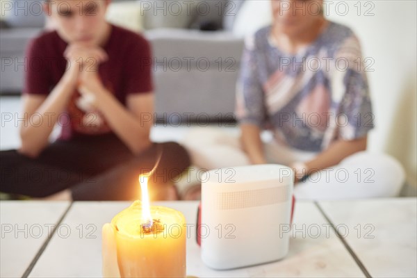 Family attending mass on cellphone