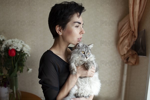 Woman and cat at home