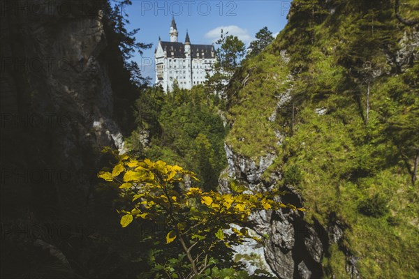 Germany, Schwangau, Scenic canyon with Neuschwanstein castle in autumn