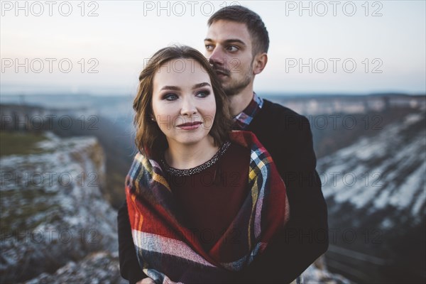 Ukraine, Crimea, Young couple hugging near canyon