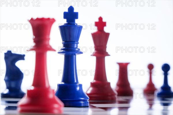 Studio shot of red and blue chess pawns symbolizing US Democratic and Republican parties