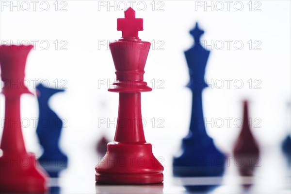 Studio shot of red and blue chess pawns symbolizing US Democratic and Republican parties