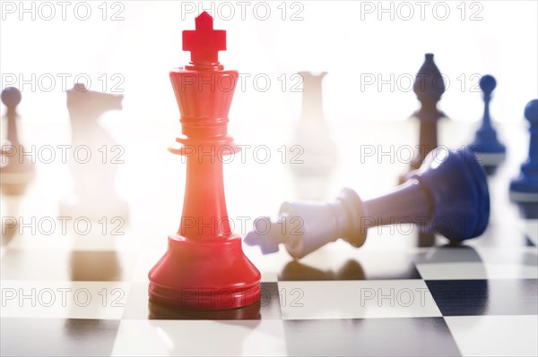 Studio shot of red and blue chess pawns symbolizing US Democratic and Republican parties