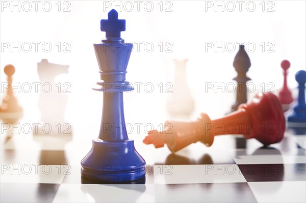 Studio shot of red and blue chess pawns symbolizing US Democratic and Republican parties