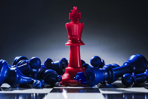 Studio shot of red and blue chess pawns symbolizing US Democratic and Republican parties