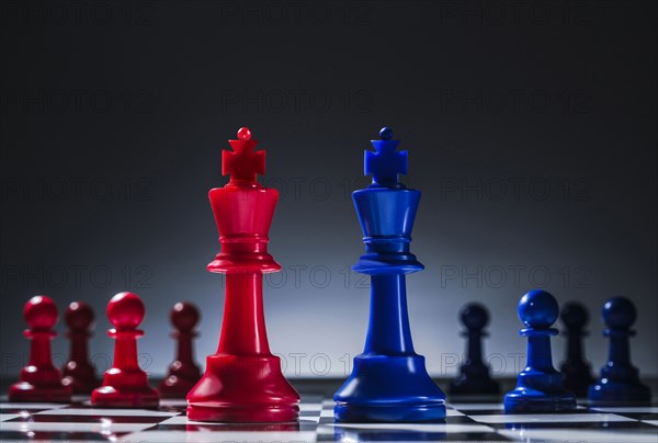 Studio shot of red and blue chess pawns symbolizing US Democratic and Republican parties