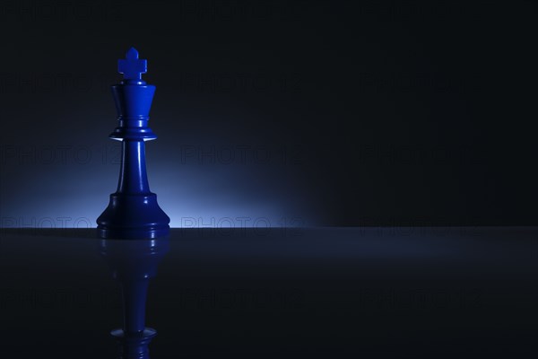 Studio shot of blue chess king