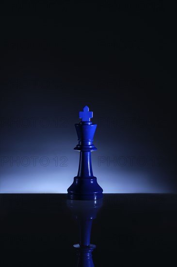 Studio shot of blue chess king