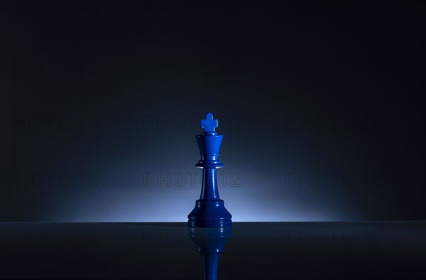 Studio shot of blue chess king