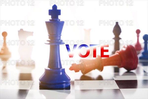 Studio shot of red and blue chess pawns symbolizing US Democratic and Republican parties