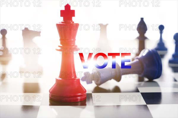 Studio shot of red and blue chess pawns symbolizing US Democratic and Republican parties