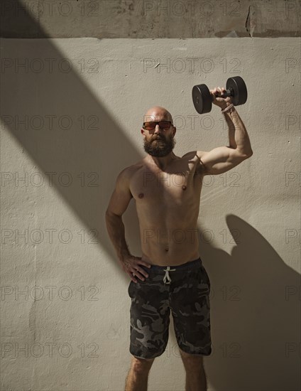 Man exercising with dumbbell