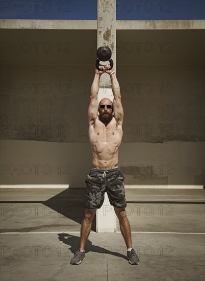 Man exercising with kettlebell