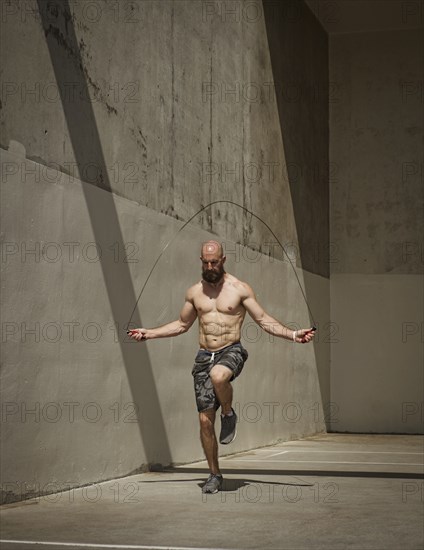 Man exercising with jumping rope