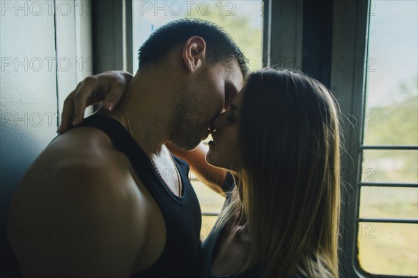 Couple kissing on train