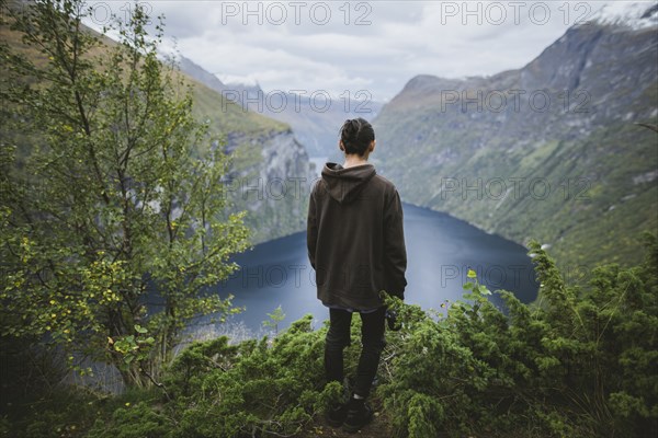 Norway, Geiranger, Man looking at scenic view of Geirangerfjord